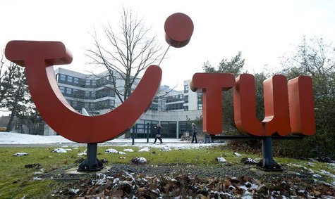 People pass the logo of German travel company TUI AG at the company's headquarters in Hanover, February 13, 2013. REUTERS/Fabian Bimmer People pass the logo of German travel company TUI AG at the company's headquarters in Hanover, February 13, 2013. REUTERS/Fabian Bimmer