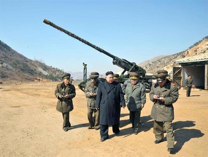 North Korean leader Kim Jong-Un (C) visits a long-range artillery sub-unit of the Korean People's Army Unit 641, whose mission is to strike North Korean leader Kim Jong-Un (C) visits a long-range artillery sub-unit of the Korean People's Army Unit 641, whose mission is to strike