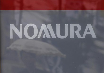A woman under an umbrella is reflected on a sign board outside a Nomura Securities branch in Tokyo August 3, 2012. REUTERS/Yuriko Nakao A woman under an umbrella is reflected on a sign board outside a Nomura Securities branch in Tokyo August 3, 2012. REUTERS/Yuriko Nakao
