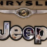 Pro Chrysler Jeep staff members are reflected in a sign at the Chrysler dealership during a meeting in Thornton, Colorado December 22, 2008. Pro Chrysler Jeep staff members are reflected in a sign at the Chrysler dealership during a meeting in Thornton, Colorado December 22, 2008.