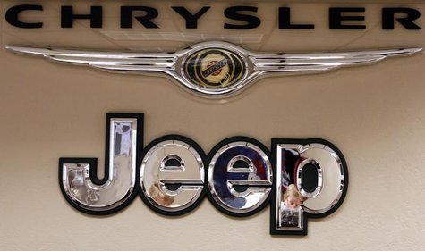 Pro Chrysler Jeep staff members are reflected in a sign at the Chrysler dealership during a meeting in Thornton, Colorado December 22, 2008. Pro Chrysler Jeep staff members are reflected in a sign at the Chrysler dealership during a meeting in Thornton, Colorado December 22, 2008.