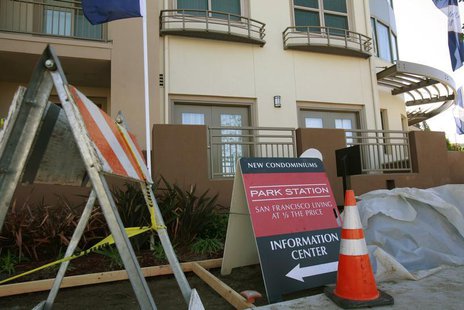 Construction equipment sits next to signs advertising new condominium homes for sale in South San Francisco, California, December 22, 2009. Construction equipment sits next to signs advertising new condominium homes for sale in South San Francisco, California, December 22, 2009.