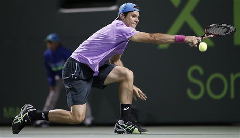 Germany's Tommy Haas stretches for a shot from Serbia's Novak Djokovic in their men's singles fourth round match at the Sony Open tennis tou Germany's Tommy Haas stretches for a shot from Serbia's Novak Djokovic in their men's singles fourth round match at the Sony Open tennis tou