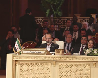 Moaz Alkhatib, head of the Syrian National Coalition, attends the Arab League summit in Doha in this March 26, 2013 handout. REUTERS/Handout Moaz Alkhatib, head of the Syrian National Coalition, attends the Arab League summit in Doha in this March 26, 2013 handout. REUTERS/Handout