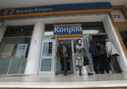 People leave a Bank of Cyprus branch in Athens March 27, 2013. REUTERS/John Kolesidis People leave a Bank of Cyprus branch in Athens March 27, 2013. REUTERS/John Kolesidis