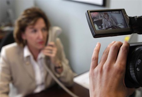 Sen. Kay Hagan (D-NC) answers phone calls from constituents in her office on Capitol Hill in Washington July 29, 2011. REUTERS/Yuri Gripas Sen. Kay Hagan (D-NC) answers phone calls from constituents in her office on Capitol Hill in Washington July 29, 2011. REUTERS/Yuri Gripas