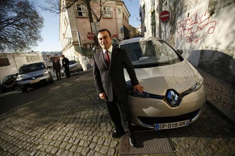 Carlos Ghosn, chairman and chief executive cfficer of French carmaker Renault, poses next to a Renault Zoe new electric car after a meeting Carlos Ghosn, chairman and chief executive cfficer of French carmaker Renault, poses next to a Renault Zoe new electric car after a meeting