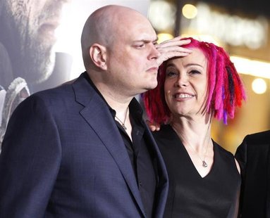 Andy Wachowski (L) and sibling Lana Wachowski, the screenwriters, producers and directors of the new film "Cloud Atlas," pose as they arrive Andy Wachowski (L) and sibling Lana Wachowski, the screenwriters, producers and directors of the new film "Cloud Atlas," pose as they arrive