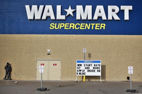 A man stands on a skateboard outside a Wal-Mart store in Williston, North Dakota March 13, 2013. REUTERS/Shannon Stapleton A man stands on a skateboard outside a Wal-Mart store in Williston, North Dakota March 13, 2013. REUTERS/Shannon Stapleton