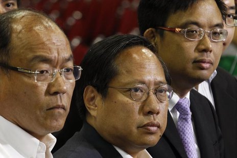 (L-R) Frederick Fung, Albert Ho and James To from the pro-democratic camp meet journalists after winning in the territory-wide poll of the L (L-R) Frederick Fung, Albert Ho and James To from the pro-democratic camp meet journalists after winning in the territory-wide poll of the L