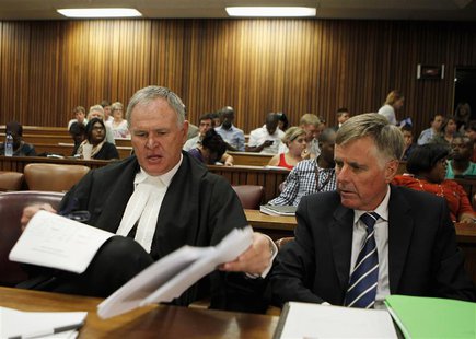 Oscar Pistorius's lawyers Barry Roux (L) and Brian Webber prepare documents before the start of the application to appeal some of his bail c Oscar Pistorius's lawyers Barry Roux (L) and Brian Webber prepare documents before the start of the application to appeal some of his bail c