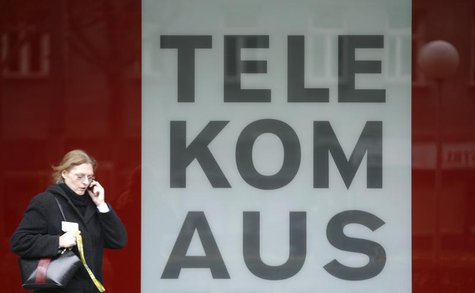 A woman talks on her mobile phone as she walks by Telekom Austria headquarters in Vienna November 10, 2008. REUTERS/Heinz-Peter Bader A woman talks on her mobile phone as she walks by Telekom Austria headquarters in Vienna November 10, 2008. REUTERS/Heinz-Peter Bader