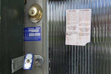 A padlock and foreclosure papers are attached to the front door of a home in the Price Hill neighborhood of Cincinnati, Ohio March 24, 2012. A padlock and foreclosure papers are attached to the front door of a home in the Price Hill neighborhood of Cincinnati, Ohio March 24, 2012.