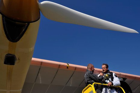 Solar Impulse Chief Executive Andre Borschberg (R) and President Bertrand Piccard celebrate after the first successful night flight attempt Solar Impulse Chief Executive Andre Borschberg (R) and President Bertrand Piccard celebrate after the first successful night flight attempt