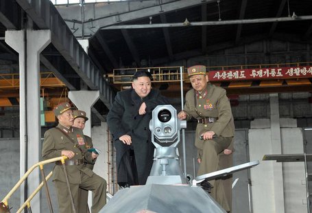North Korean leader Kim Jong-un (2nd R) looks at the latest combat and technical equipments, made by unit 1501 of the Korean People's Army, North Korean leader Kim Jong-un (2nd R) looks at the latest combat and technical equipments, made by unit 1501 of the Korean People's Army,