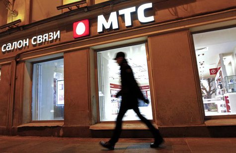 A man walks past an MTS shop in St.Petersburg March 18, 2013. REUTERS/Alexander Demianchuk A man walks past an MTS shop in St.Petersburg March 18, 2013. REUTERS/Alexander Demianchuk