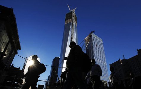 People walk by the World Trade Center site before ceremonies marking the 11th anniversary of the September 11, 2001 attacks on the World Tra People walk by the World Trade Center site before ceremonies marking the 11th anniversary of the September 11, 2001 attacks on the World Tra