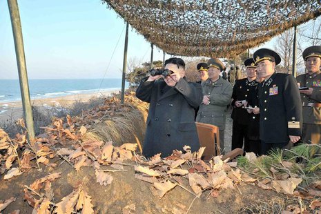 North Korean leader Kim Jong-Un (L) watches soldiers of the Korean People's Army (KPA) taking part in the landing and anti-landing drills of North Korean leader Kim Jong-Un (L) watches soldiers of the Korean People's Army (KPA) taking part in the landing and anti-landing drills of