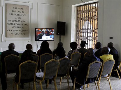 People watch a live broadcast on the last day of the presidential poll petition in Kenya's capital Nairobi, March 28, 2013. REUTERS/Noor Kha People watch a live broadcast on the last day of the presidential poll petition in Kenya's capital Nairobi, March 28, 2013. REUTERS/Noor Kha
