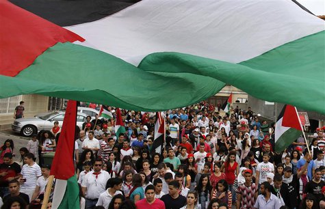 Israeli Arab demonstrators march during a demonstration marking Land Day in the northern town of Sakhnin March 30, 2013. REUTERS/Ammar Awad Israeli Arab demonstrators march during a demonstration marking Land Day in the northern town of Sakhnin March 30, 2013. REUTERS/Ammar Awad