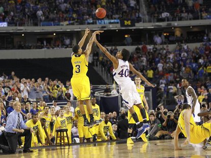 Michigan Wolverines guard Trey Burke shoots a three point basket over Kansas Jayhawks forward Kevin Young to tie the game during the second half in their South Regional NCAA men's basketball game in Arlington, Texas March 29, 2013. REUTERS/Mike Stone (UNITED STATES - Tags: SPORT BASKETBALL)
Photo: REUTERS Michigan Wolverines guard Trey Burke shoots a three point basket over Kansas Jayhawks forward Kevin Young to tie the game during the second half in their South Regional NCAA men's basketball game in Arlington, Texas March 29, 2013. REUTERS/Mike Stone (UNITED STATES - Tags: SPORT BASKETBALL)
Photo: REUTERS