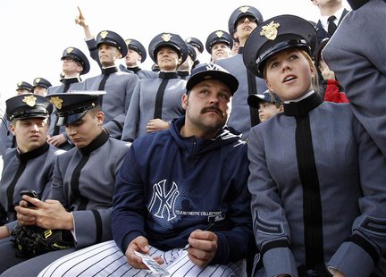 New York Yankees relief pitcher Joba Chamberlain looks on from the bleachers with cadets from the U.S. Military Academy during an exhibition New York Yankees relief pitcher Joba Chamberlain looks on from the bleachers with cadets from the U.S. Military Academy during an exhibition
