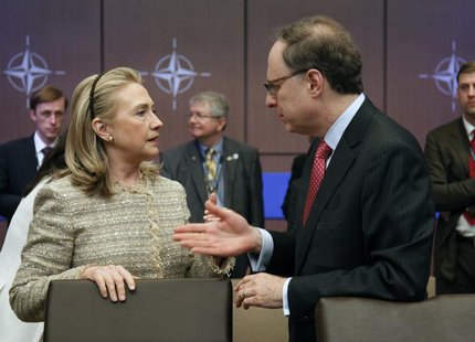 U.S. Secretary of State Hillary Clinton (L) talks to NATO Deputy Secretary General Alexander Vershbow before a Foreign Ministers meeting wit U.S. Secretary of State Hillary Clinton (L) talks to NATO Deputy Secretary General Alexander Vershbow before a Foreign Ministers meeting wit