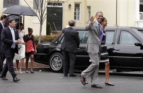 U.S. President Barack Obama waves as he walks with first lady Michelle Obama (L) and their daughters Malia (R) and Sasha after attending Eas U.S. President Barack Obama waves as he walks with first lady Michelle Obama (L) and their daughters Malia (R) and Sasha after attending Eas