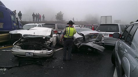 Rescue workers look over the scene on I-77 where approximately 75 vehicles were involved in an accident in Carroll County, Virginia near the Rescue workers look over the scene on I-77 where approximately 75 vehicles were involved in an accident in Carroll County, Virginia near the
