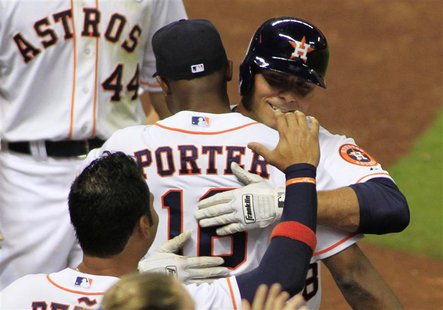 Houston Astro's Rick Ankiel (R) hugs manager Bo Porter after his three-run home run in the sixth inning against the Texas Rangers during the Houston Astro's Rick Ankiel (R) hugs manager Bo Porter after his three-run home run in the sixth inning against the Texas Rangers during the
