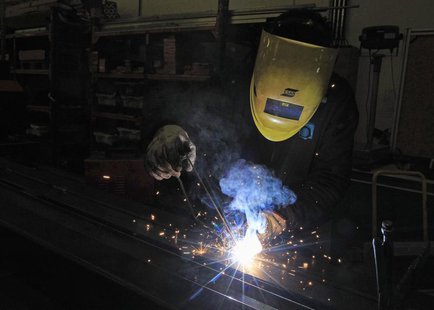 A worker welds at a Portuguese exporting factory in Pontinha, on the outskirts of Lisbon March 18, 2013. REUTERS/Jose Manuel Ribeiro A worker welds at a Portuguese exporting factory in Pontinha, on the outskirts of Lisbon March 18, 2013. REUTERS/Jose Manuel Ribeiro