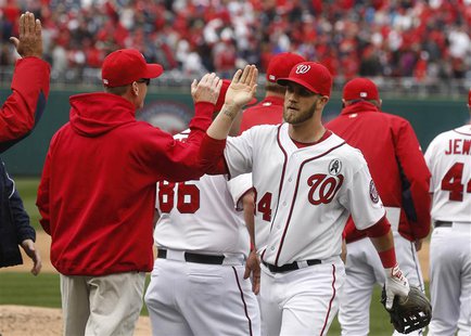 Washington Nationals Bryce Harper celebrates after the last out of a opening day MLB National League game against Miami Marlins in Washingto Washington Nationals Bryce Harper celebrates after the last out of a opening day MLB National League game against Miami Marlins in Washingto