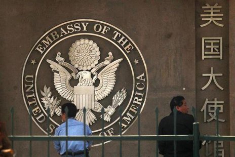 People waiting to apply for visas sit outside the U.S. embassy in Beijing May 3, 2011. REUTERS/David Gray People waiting to apply for visas sit outside the U.S. embassy in Beijing May 3, 2011. REUTERS/David Gray