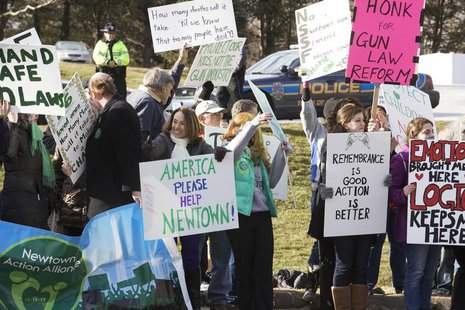 Residents protest outside the National Shooting Sports Foundation in Newtown, Connecticut March 28, 2013 after receiving robocalls from the Residents protest outside the National Shooting Sports Foundation in Newtown, Connecticut March 28, 2013 after receiving robocalls from the