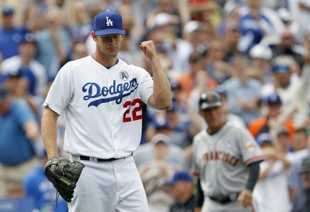 Los Angeles Dodgers starting pitcher Clayton Kershaw pumps his fist as the Dodgers defeat the San Francisco Giants 4-0 during their MLB Nati Los Angeles Dodgers starting pitcher Clayton Kershaw pumps his fist as the Dodgers defeat the San Francisco Giants 4-0 during their MLB Nati