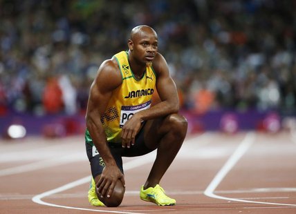 Jamaica's Asafa Powell looks at the scoreboard after running in the men's 100m final during the London 2012 Olympic Games at the Olympic Sta Jamaica's Asafa Powell looks at the scoreboard after running in the men's 100m final during the London 2012 Olympic Games at the Olympic Sta