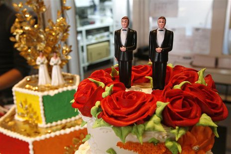 Bride and groom figurines are on display on wedding cakes at Cake and Art bakery in West Hollywood, California June 4, 2008. REUTERS/Mario A Bride and groom figurines are on display on wedding cakes at Cake and Art bakery in West Hollywood, California June 4, 2008. REUTERS/Mario A