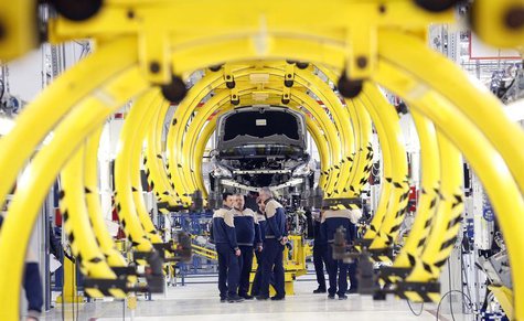 Employees stand in front of a new car at the Maserati new opening plant in Turin, January 30, 2013. REUTERS/Stefano Rellandini Employees stand in front of a new car at the Maserati new opening plant in Turin, January 30, 2013. REUTERS/Stefano Rellandini