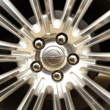 A Chrysler logo is seen on the wheel of a new car at a dealership in Vienna, Virginia April 26, 2012. REUTERS/Kevin Lamarque