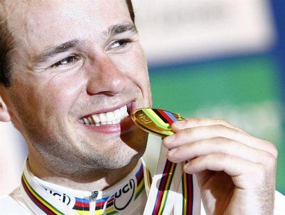 Denmark's Alex Rasmussen poses with his gold medal after the medals ceremony for the Men's Scratch final during the UCI 2010 World Track Cyc Denmark's Alex Rasmussen poses with his gold medal after the medals ceremony for the Men's Scratch final during the UCI 2010 World Track Cyc