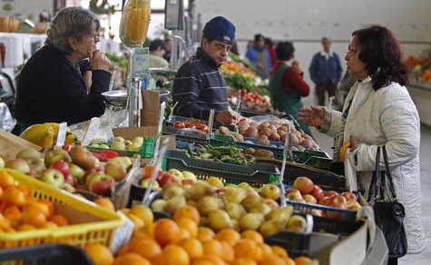 People talk at the vegetable market in Olhao in the southern Portuguese province of Algarve March 12, 2013. REUTERS/Jose Manuel Ribeiro People talk at the vegetable market in Olhao in the southern Portuguese province of Algarve March 12, 2013. REUTERS/Jose Manuel Ribeiro