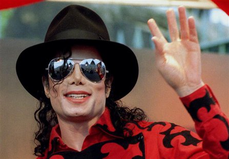 Michael Jackson waves to the crowd, numbering a few thousand, gathered in front of the Sydney Opera House in this November 17, 1996 file pho Michael Jackson waves to the crowd, numbering a few thousand, gathered in front of the Sydney Opera House in this November 17, 1996 file pho