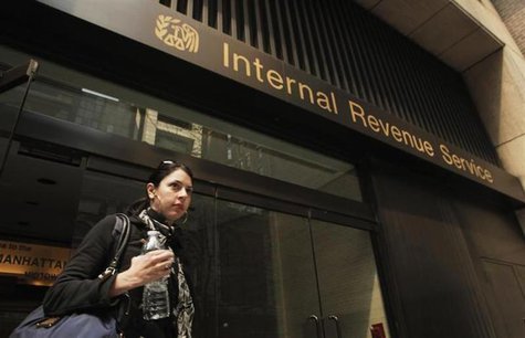 woman walks out of an Internal Revenue Service office in New York 