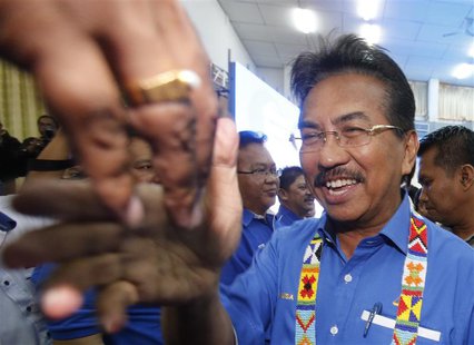 Malaysia's state of Sabah Chief Minister Musa Aman is greeted upon his arrival at his National Front coalition's pre-election campaign in Ke Malaysia's state of Sabah Chief Minister Musa Aman is greeted upon his arrival at his National Front coalition's pre-election campaign in Ke
