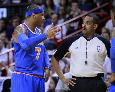 New York Knicks small forward Carmelo Anthony (L) argues with referee Bennie Adams after Adams called a technical foul on Anthony as they me New York Knicks small forward Carmelo Anthony (L) argues with referee Bennie Adams after Adams called a technical foul on Anthony as they me