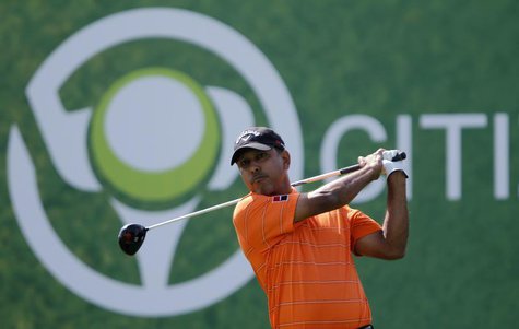 Jeev Milkha Singh of India watches his shot from the second tee during the fourth and final round of the Dubai Desert Classic at the Emirate Jeev Milkha Singh of India watches his shot from the second tee during the fourth and final round of the Dubai Desert Classic at the Emirate