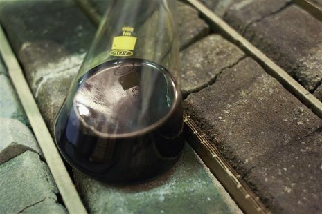 A vessel containing oil is placed on core samples of oil-bearing rock from Russia's oil heartland in West Siberia at a warehouse of the Tyum A vessel containing oil is placed on core samples of oil-bearing rock from Russia's oil heartland in West Siberia at a warehouse of the Tyum