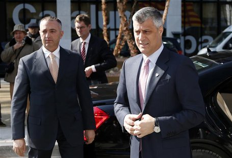 Kosovo's Prime Minister Hashim Thaci (R) arrives for a meeting with Serbian Prime Minister Ivica Dacic (unseen) and European Union foreign p Kosovo's Prime Minister Hashim Thaci (R) arrives for a meeting with Serbian Prime Minister Ivica Dacic (unseen) and European Union foreign p