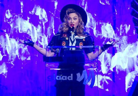 Singer Madonna presents the Vito Russo Award to journalist Anderson Cooper (not seen) during the 24th Annual GLAAD Media Awards in New York, Singer Madonna presents the Vito Russo Award to journalist Anderson Cooper (not seen) during the 24th Annual GLAAD Media Awards in New York,