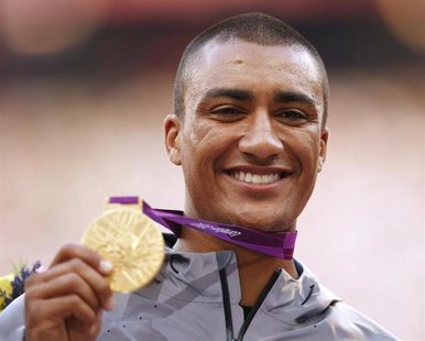 Ashton Eaton of the U.S. displays his gold medal for the men's decathlon event at the London 2012 Olympic Games in London at the Olympic Sta Ashton Eaton of the U.S. displays his gold medal for the men's decathlon event at the London 2012 Olympic Games in London at the Olympic Sta
